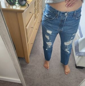 Woman's Levi's 501 Distressed Blue Jeans